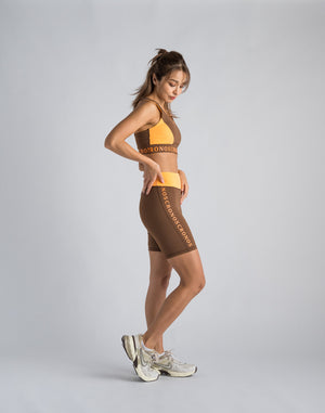 CRONOS WOMEN SWITCHED LOGO SHORT LEGGINGS【BROWN】