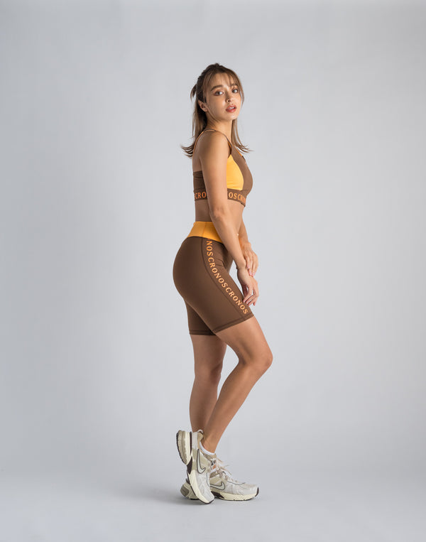 CRONOS WOMEN SWITCHED LOGO SHORT LEGGINGS【BROWN】