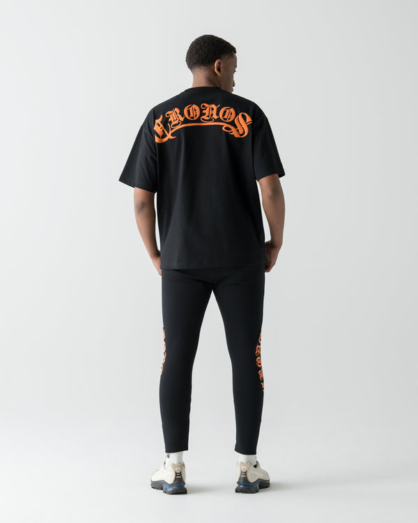 CRONOS BLACKLETTER SKINNY PANTS【BLACK×ORANGE】